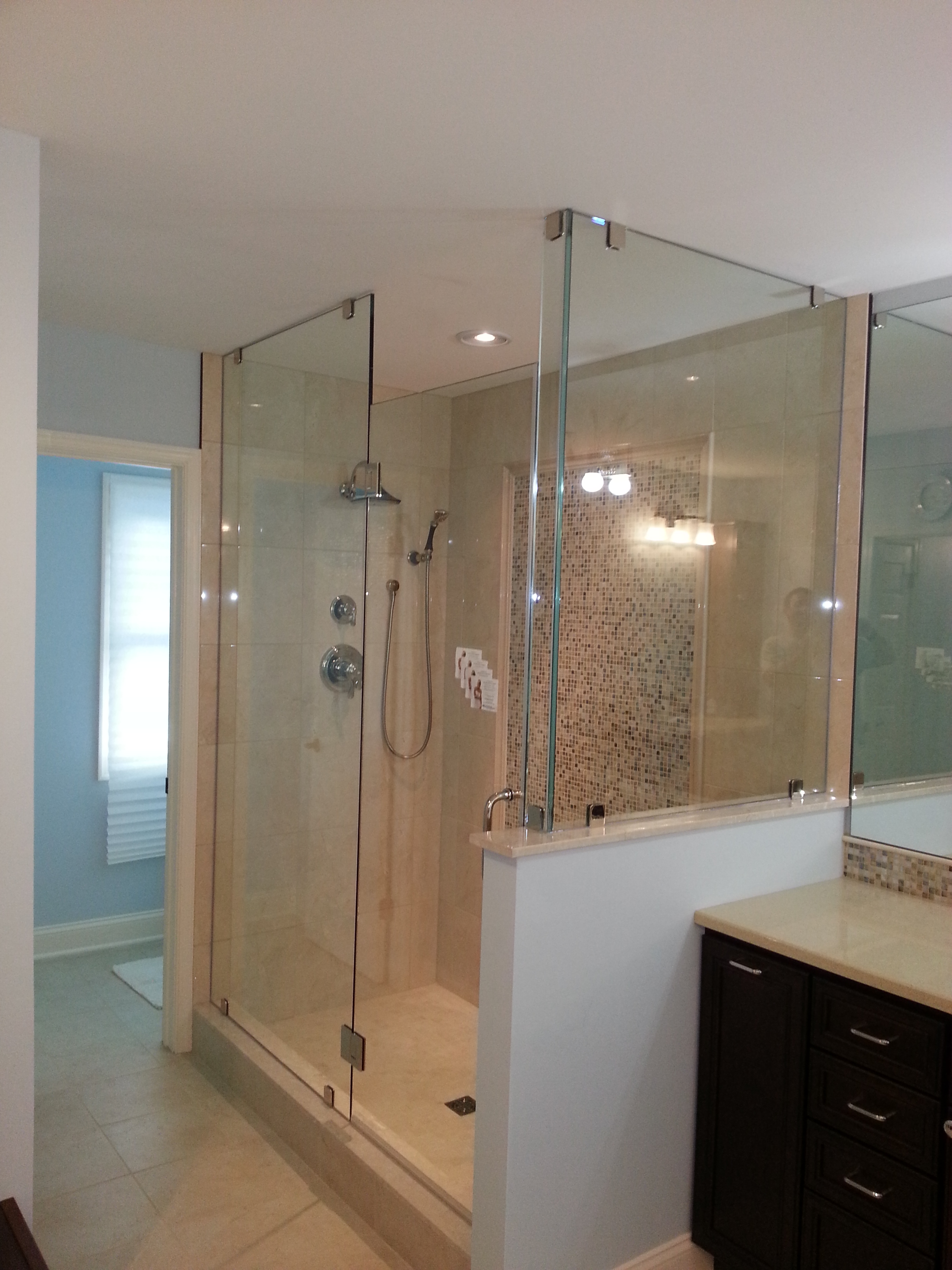 Glass Shower Enclosure in Refinished Bathroom